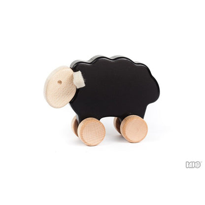 Svört Kind úr tré - Sheep on Wheels